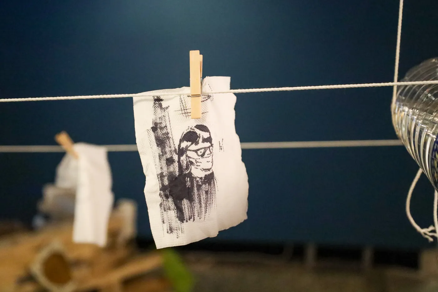 Napkins clipped along the rotating string loop.