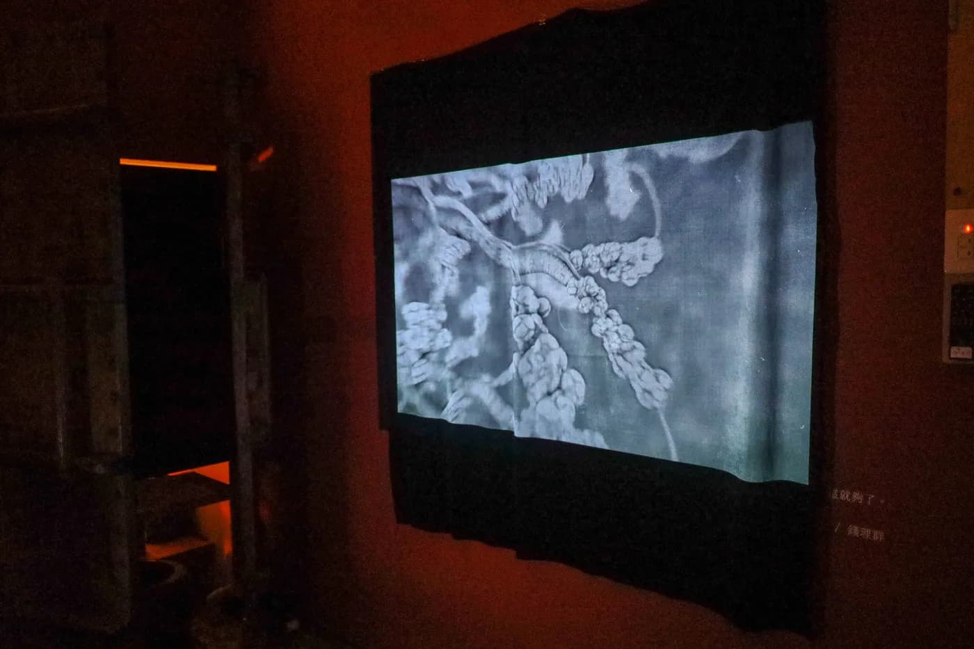 The bronchial projection seen from across the room, with visitors silhouetted against it.