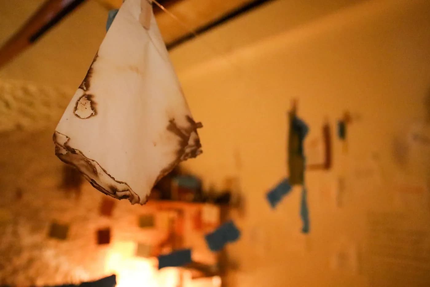 The waves of strung napkins seen along the length of the room.